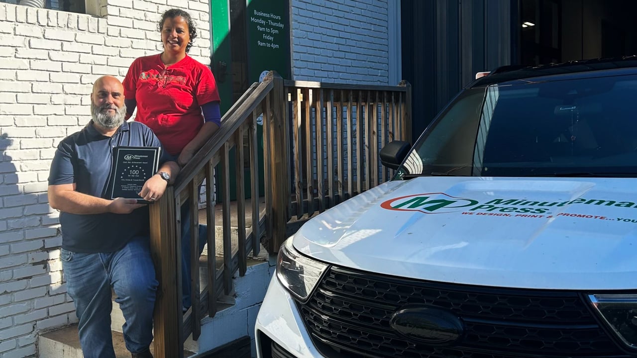 Minuteman Press Franchise Owners Eric & Ericka Burrill at Minuteman Press in Avondale Estates, GA.