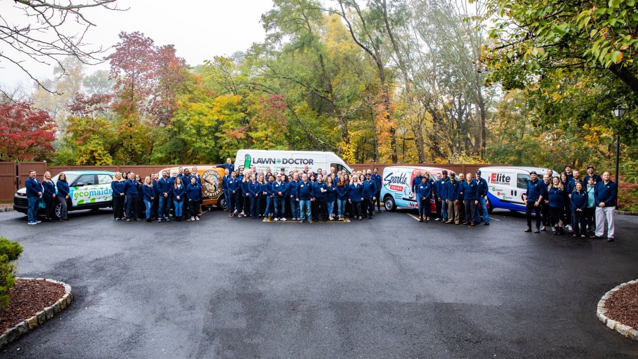 Photo of Happinest Brands vans and teams standing together