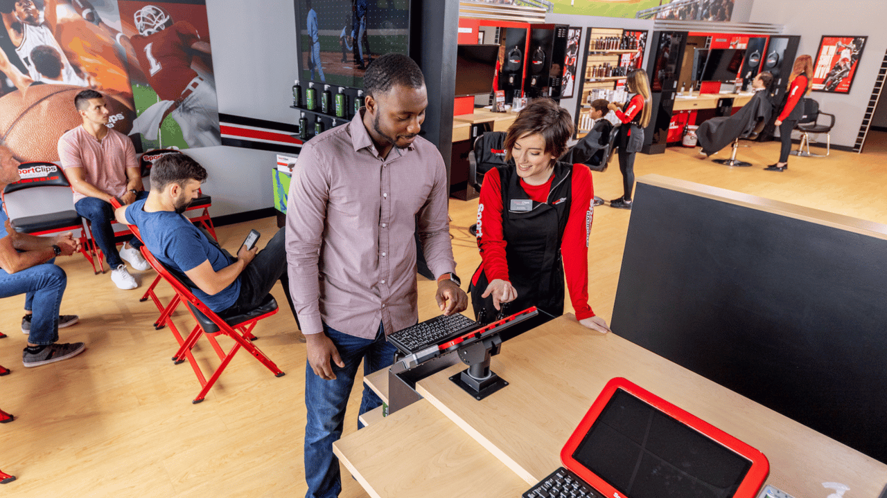 image of a sport clips franchise being successful and a sport clips hairstylist being friendly