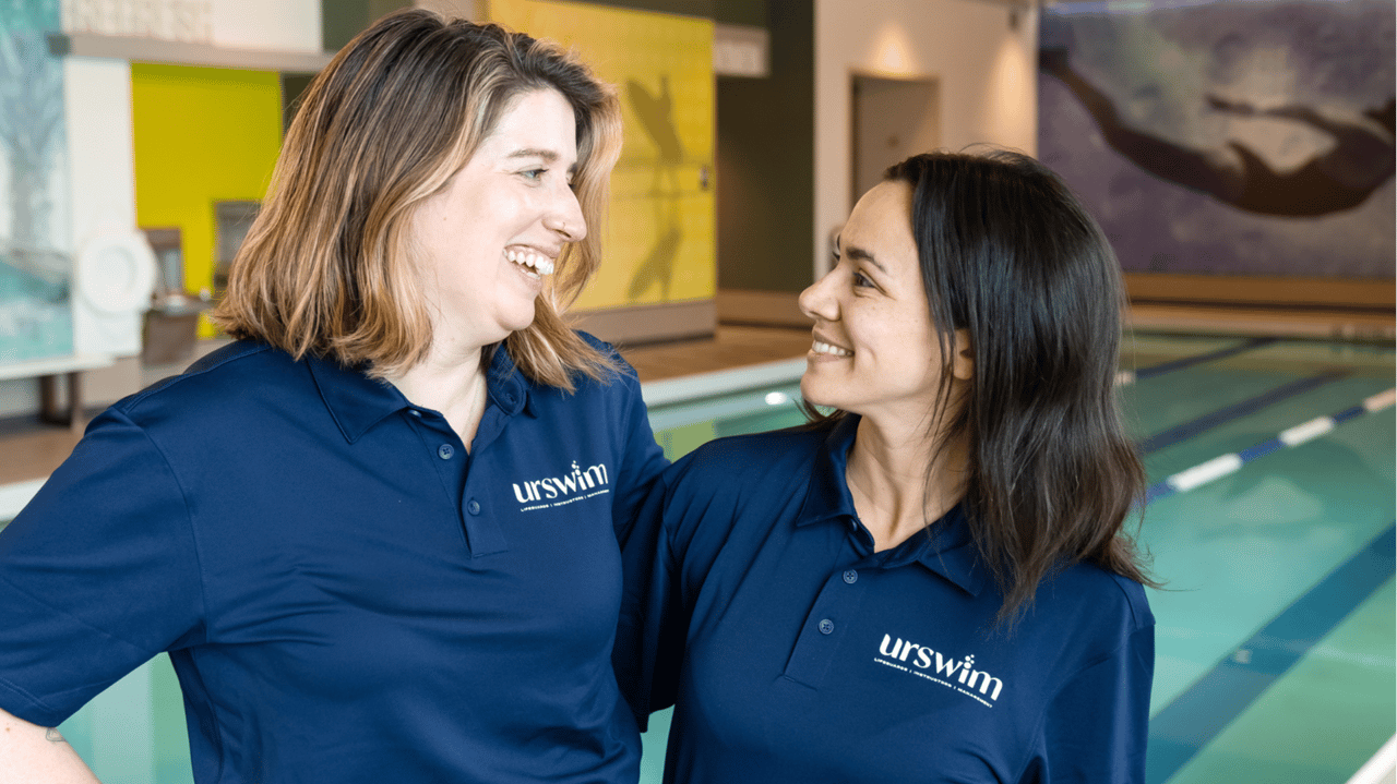 Photo of two urSwim team members inside facility