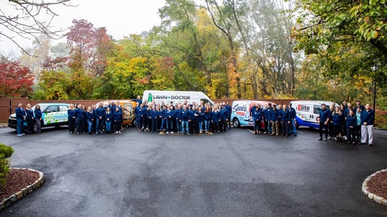 Photo of Happinest Brands vans and teams standing together