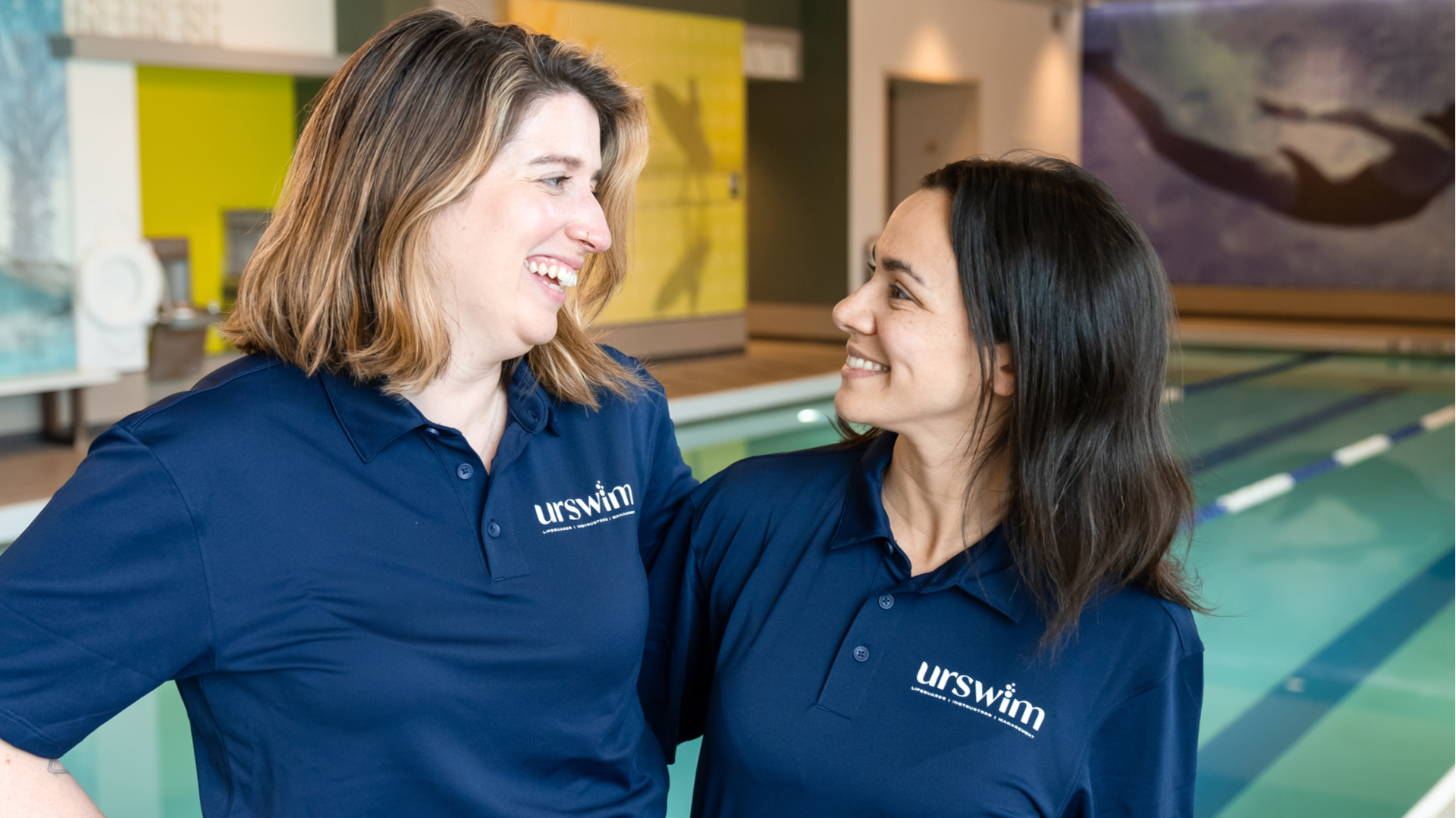 Photo of two urSwim team members inside facility