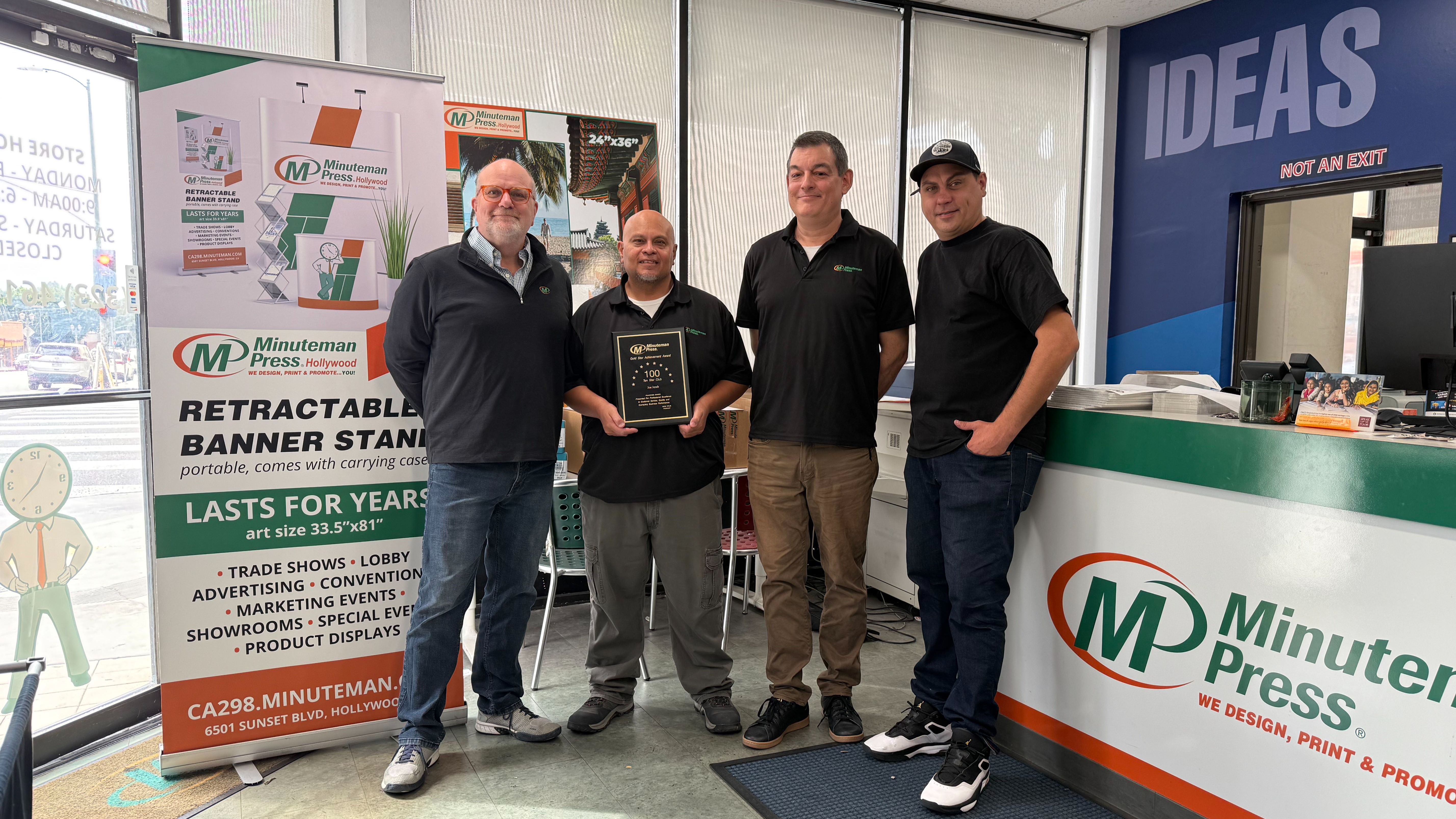 Minuteman Press Franchise Owner Joe Jereb (left) pictured with his dedicated team in Hollywood, CA.
