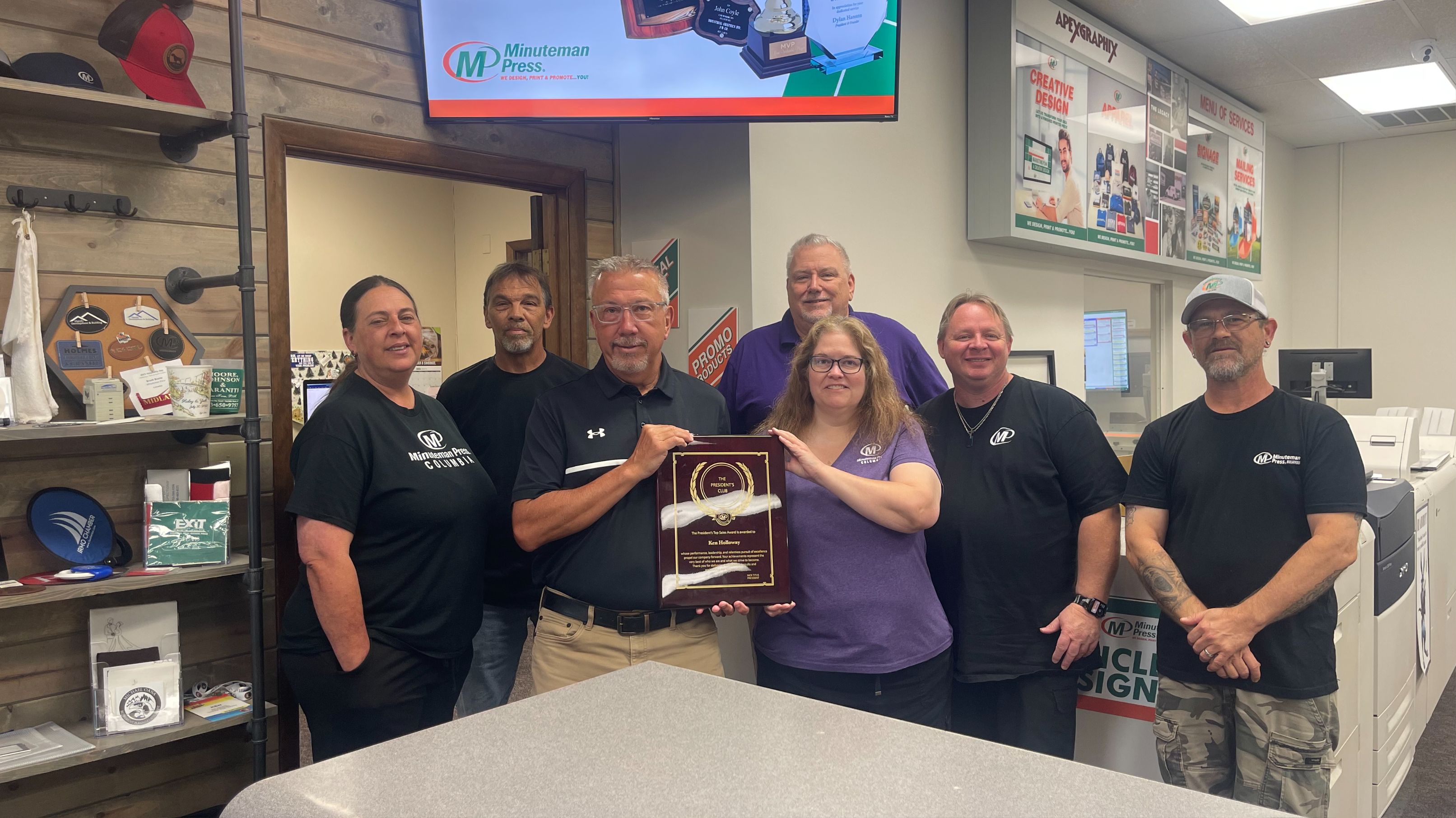Minuteman Press Franchise Owner Ken Holloway (3rd from left) and his team in Columbia, SC.